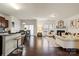 Open-concept living room and dining area featuring hardwood floors with easy access to the kitchen at 5703 Eleanor Rigby Rd, Charlotte, NC 28278