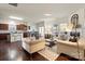 Open-concept living room featuring hardwood floors and easy access to the kitchen at 5703 Eleanor Rigby Rd, Charlotte, NC 28278