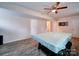 Unfinished basement with laminate floors, ceiling fan, and a pool table with a cover at 5743 Cherrycrest Ln, Charlotte, NC 28217