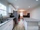 Bright kitchen with stainless steel appliances, granite countertops, and an island for additional workspace at 5743 Cherrycrest Ln, Charlotte, NC 28217