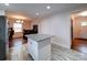 Open kitchen with center island, stainless appliances, granite countertops, and connection to the dining area at 5743 Cherrycrest Ln, Charlotte, NC 28217