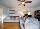 Cozy living room with hardwood floors, modern furnishings, and open shelving, creating a welcoming atmosphere at 5743 Cherrycrest Ln, Charlotte, NC 28217