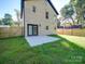 Newly built home featuring a fenced backyard and concrete patio, perfect for outdoor entertaining at 588 Washington Ln, Albemarle, NC 28001