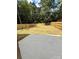 Spacious backyard featuring a concrete patio and a newly installed wood fence at 588 Washington Ln, Albemarle, NC 28001