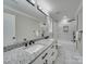 Elegant bathroom features a double vanity, granite counters, tiled shower, and soaking tub at 588 Washington Ln, Albemarle, NC 28001