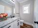 Stylish half bathroom with granite countertop, modern fixtures, and decorative accents at 588 Washington Ln, Albemarle, NC 28001