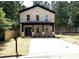 Charming two-story brick home featuring a covered porch and a spacious concrete driveway at 588 Washington Ln, Albemarle, NC 28001
