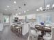 Bright, open kitchen featuring a granite island with bar seating and a cozy breakfast nook for casual dining at 588 Washington Ln, Albemarle, NC 28001