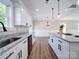 Well-appointed kitchen with granite countertops, stainless steel appliances, and an island that connects to the living spaces at 588 Washington Ln, Albemarle, NC 28001