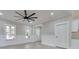 Bright living room with modern finishes, featuring oversized fan, wainscotting, and plenty of natural light at 588 Washington Ln, Albemarle, NC 28001