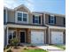 New townhome exterior showing brick accents, attached garages, and professional landscaping at #603 Mt. Mitchell Ave # 603, Gastonia, NC 28052