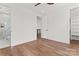 Spacious bedroom featuring hardwood floors, ensuite bath and walk-in closet at 621 Poindexter Dr, Charlotte, NC 28209