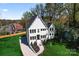 Beautiful, modern farmhouse with striking curb appeal, complemented by a lush green lawn and manicured landscaping at 621 Poindexter Dr, Charlotte, NC 28209