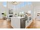 Bright open kitchen featuring large island with built-in appliances and adjacent living space at 621 Poindexter Dr, Charlotte, NC 28209