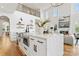 Modern, open kitchen with large island, stainless steel appliances, and view of the living room at 621 Poindexter Dr, Charlotte, NC 28209