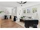 Inviting living room featuring hardwood floors, neutral decor, and abundant natural light at 621 Poindexter Dr, Charlotte, NC 28209