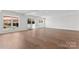 Open-concept living area with hardwood floors, recessed lighting, and sliding glass doors at 621 Poindexter Dr, Charlotte, NC 28209