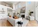 Open living room with fireplace, high ceilings, and contemporary design at 621 Poindexter Dr, Charlotte, NC 28209