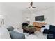 Comfortable living room with stylish furniture, hardwood floors, and a modern ceiling fan at 621 Poindexter Dr, Charlotte, NC 28209