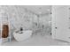 Stunning bathroom features a soaking tub, walk-in shower, and modern tile work at 621 Poindexter Dr, Charlotte, NC 28209