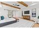 Bright main bedroom features exposed beams, an ensuite bath, and plenty of natural light at 621 Poindexter Dr, Charlotte, NC 28209
