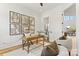 Charming home office with a stylish desk, decorative maps, and an adjacent bathroom at 621 Poindexter Dr, Charlotte, NC 28209