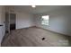 Spacious bedroom with neutral carpet, natural light, and a view of the outdoors at 7051 Maple Glen Dr, Catawba, NC 28609