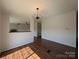 Open dining area with wood-look floors, decorative chandelier and easy access to other rooms at 7051 Maple Glen Dr, Catawba, NC 28609