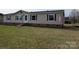 Traditional single-story home with vinyl siding and a well-manicured lawn and American flag at 7051 Maple Glen Dr, Catawba, NC 28609