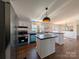 Spacious kitchen with updated cabinets, stainless steel appliances, and an island, creating an inviting space at 7051 Maple Glen Dr, Catawba, NC 28609