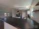 Close-up of a modern kitchen island with dark countertops and white cabinets at 7051 Maple Glen Dr, Catawba, NC 28609