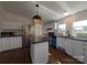 Bright kitchen with white cabinets, stainless steel appliances, and central island with dark countertop at 7051 Maple Glen Dr, Catawba, NC 28609