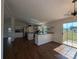 Bright, modern kitchen with white cabinets, stainless steel appliances, and an adjacent dining area at 7051 Maple Glen Dr, Catawba, NC 28609
