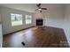Living room showcasing fireplace with large windows that provide natural lighting at 7051 Maple Glen Dr, Catawba, NC 28609