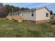 Exterior angle of a home featuring wooden decks and a view of the surrounding yard at 7051 Maple Glen Dr, Catawba, NC 28609