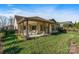 Beautiful backyard featuring a covered patio with ample seating, perfect for entertaining and relaxation at 7127 Hanging Rock Ct, Denver, NC 28037