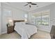 Tranquil bedroom with natural light, a cozy queen-size bed, and wood accents at 7127 Hanging Rock Ct, Denver, NC 28037