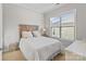 Bright bedroom with a large window, neutral decor, and comfortable furnishings at 7127 Hanging Rock Ct, Denver, NC 28037