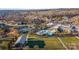 Aerial view of the community amenities featuring a pool, tennis courts, and a clubhouse at 7127 Hanging Rock Ct, Denver, NC 28037