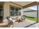Relaxing outdoor patio with comfortable seating and a neutral rug at 7127 Hanging Rock Ct, Denver, NC 28037