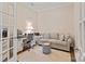 Cozy home office featuring a sofa, desk, chair and soft neutral colors at 7127 Hanging Rock Ct, Denver, NC 28037