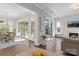Bright living room features an open floor plan with sight lines to dining area and outside patio at 7127 Hanging Rock Ct, Denver, NC 28037