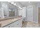 Bathroom with double sinks, a large walk-in shower, and a separate vanity area at 7127 Hanging Rock Ct, Denver, NC 28037