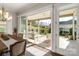 Covered patio with outdoor seating and a view of the landscaped backyard at 7127 Hanging Rock Ct, Denver, NC 28037