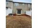 Private backyard with a patio and lush green lawn at 7141 Adare Mews Rd, Charlotte, NC 28217