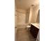 Bathroom showcases a shower over tub with dark cabinets, and a tile floor at 7141 Adare Mews Rd, Charlotte, NC 28217