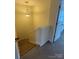 Cozy staircase illuminated by a pendant light, offering a welcoming transition between floors of the home at 7141 Adare Mews Rd, Charlotte, NC 28217