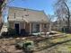 Backyard view of the rear house elevation with patio at 7310 Yorkville Ct, Charlotte, NC 28273