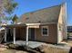 Backyard view of the rear house elevation showing covered patio at 7310 Yorkville Ct, Charlotte, NC 28273