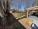 Backyard view of the rear house elevation with large yard at 7310 Yorkville Ct, Charlotte, NC 28273